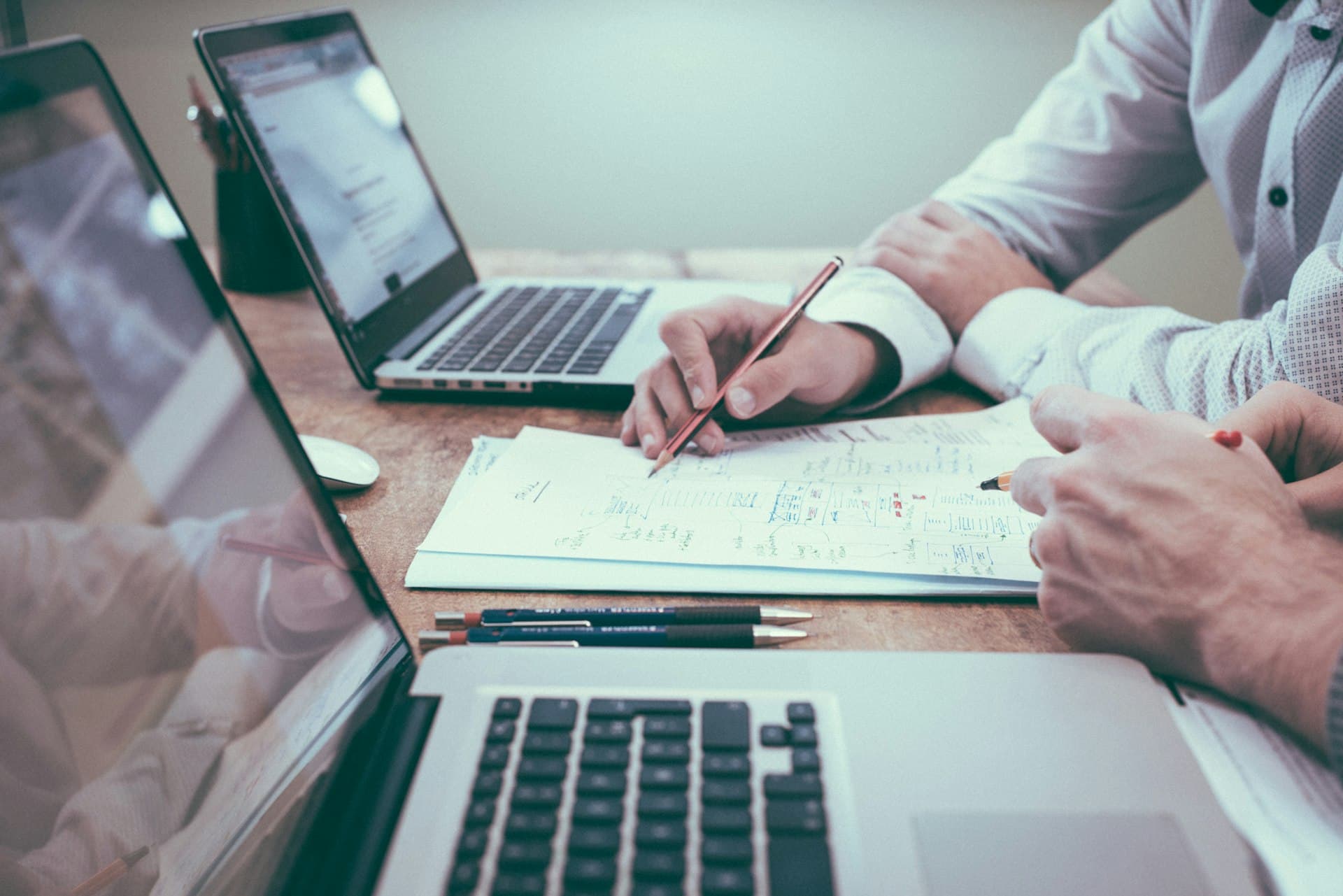 Insurance professional reviewing documents with a client